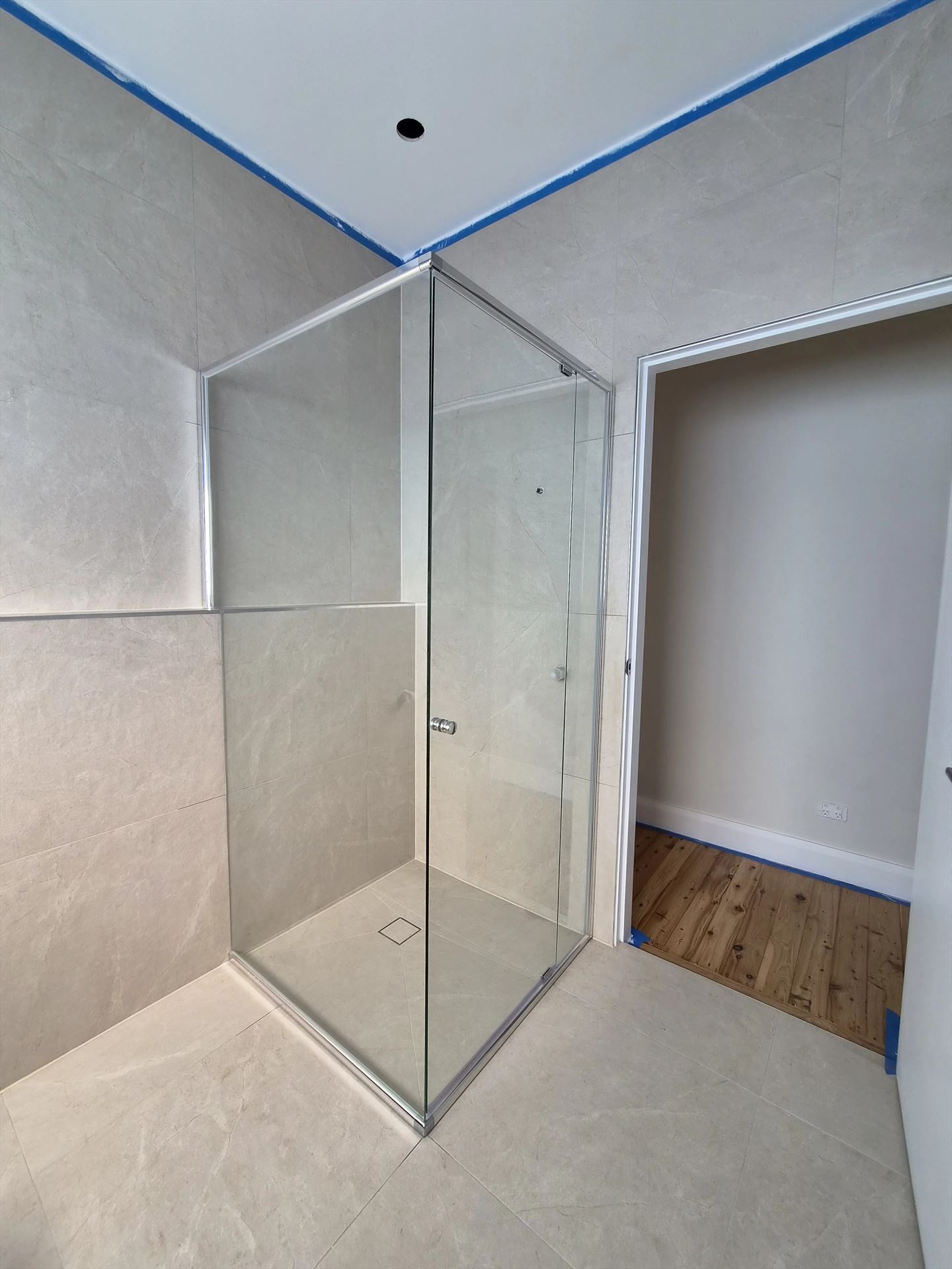 semi shower screen with chrome hardware installed in Seven Hills by Showerland