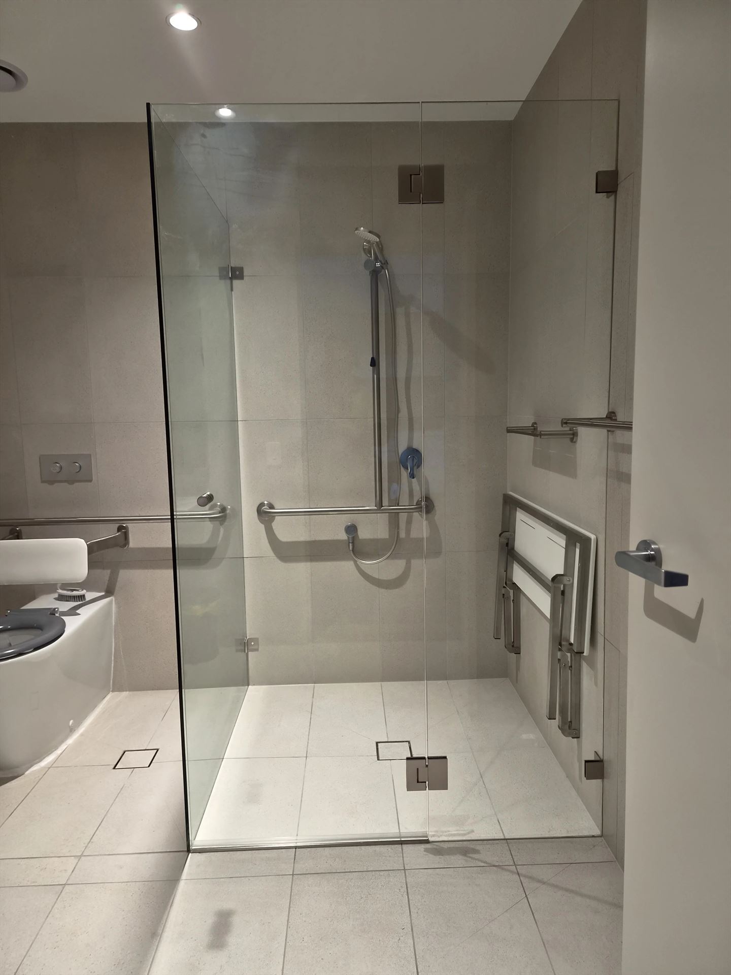 frameless shower screen with chrome hardware installed in Epping by Showerland