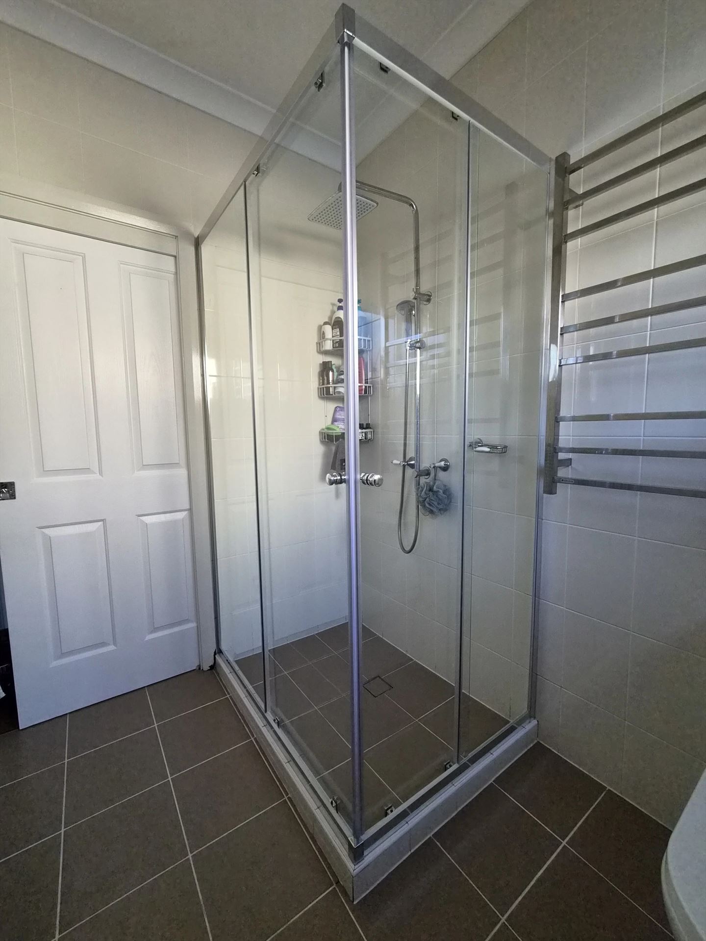 semi shower screen with chrome hardware installed in Blacktown by Showerland