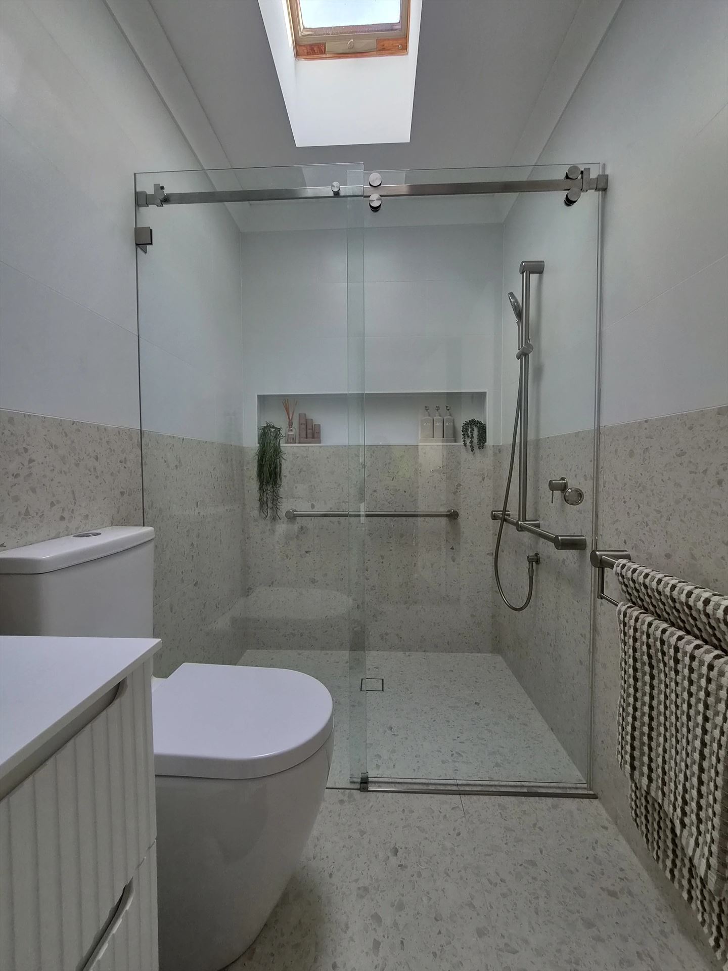 frameless shower screen with chrome hardware installed in Northmead by Showerland
